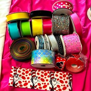 18 rolls of assorted ribbons.These have been used not sure of exact amt on each
